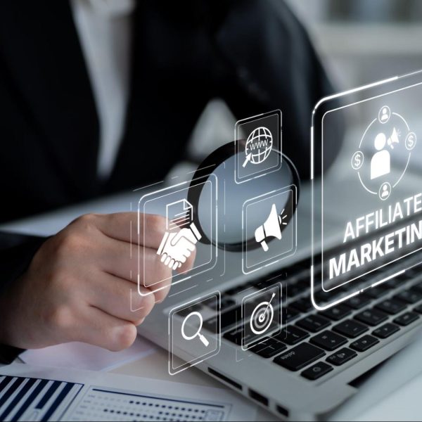 affiliate marketing concept on laptop with digital marketing icons