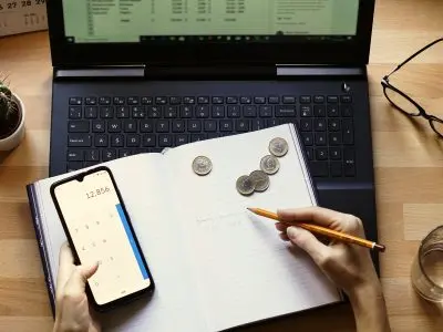 Closeup shot of an entrepreneur working from home on his personal finances and savings