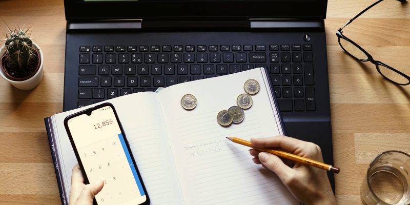 Closeup shot of an entrepreneur working from home on his personal finances and savings